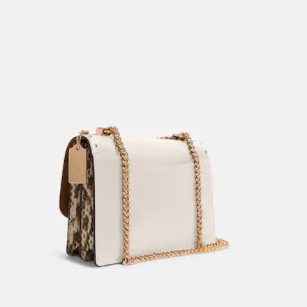 Klare Crossbody In Signature Canvas With Rivets